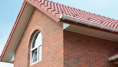 Attic red brick house with soffit